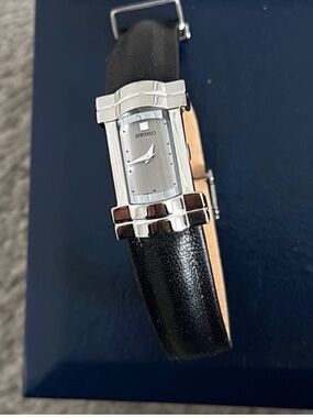 Seiko Black leather band , silver rectangular face , new batteries replaced